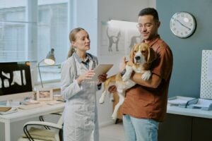 Veterinarian at Autumn Trails Veterinary Center in Charlottesville explaining common pet dental myths to dog owner